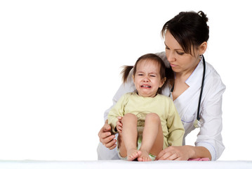 Beautiful happy nurse with a girl sitting