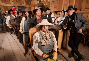 Serious Group of People in Old West Tavern