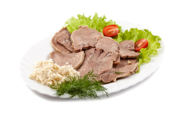 Boiled veal tongue with greens and a horse-radish