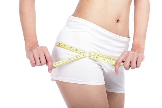 close up Woman measuring shape of hips