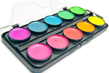 box of paints on white