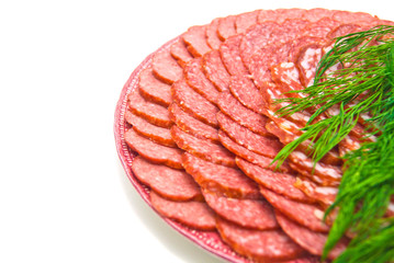 sausage with herbs on plate. close-up