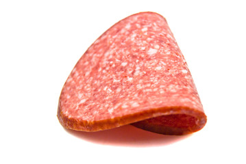 single slice of sausage on white