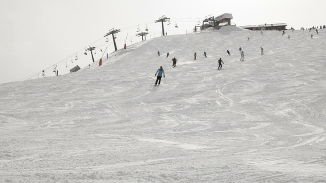 Skiers going down the slope