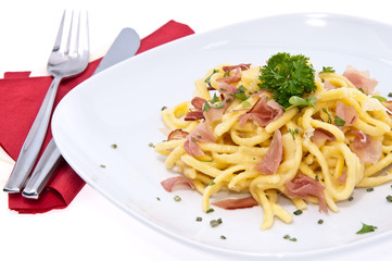 Plate with Cheese Spaetzle isolated on white