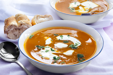 Bowls of Pumpkin Soup with Bread