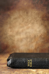 Fototapeta premium Bible with Grunge Stone Background