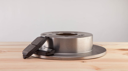 Brake Disks and Pads on a woden workbench
