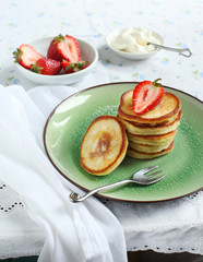 Pancakes with strawberry and cream