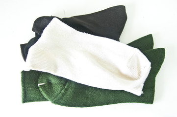 A stack of many socks isolated on a white