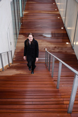 Brunette Woman Walking Up Stairs