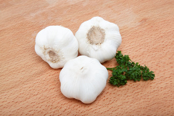garlic bulb isolated on wooden table.