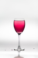 Wineglass full of pink wine