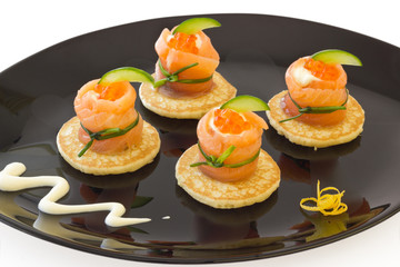 Red salmon rolls with cheese, caviar and cucumber