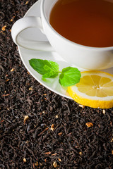 White cup of tea with mint leaf