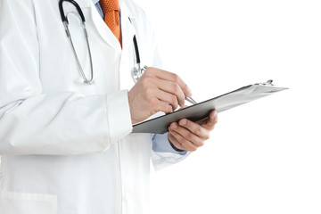 Doctor writing notes at the clipboard isolated on white