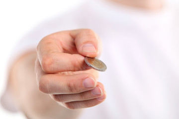 Young caucasian man holding a two euro coin.