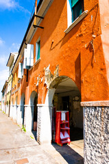 Fototapeta na wymiar porch and old houses in Fabbrico, Italy
