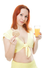 Young woman with orange juice and loaves