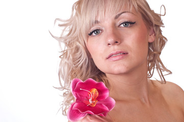 Obraz na płótnie Canvas Nude female body with flower on her shoulder