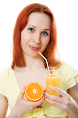 Young woman with oranges and juice