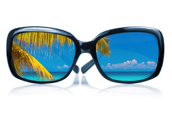 Sunglasses with a beach scene reflected on the glass