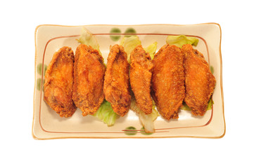 A Plate Of Fried Chicken Wings