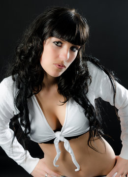 Bare midriff and cleveage accent a pretty girl