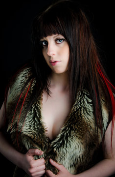 Pretty girl with fur vest and very much cleveage