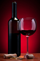 glass and bottle of red wine