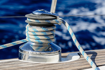 Sailing boat winch with rope closeup