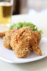 Fried Chicken with tomato vegetable and beer