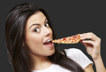 woman eating pizza
