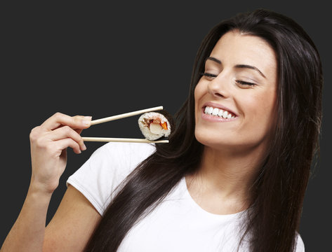 woman eating sushi