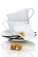 Tea cups, sugar and vanilla.
