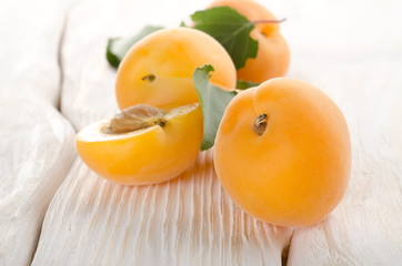 Apricots on a white table