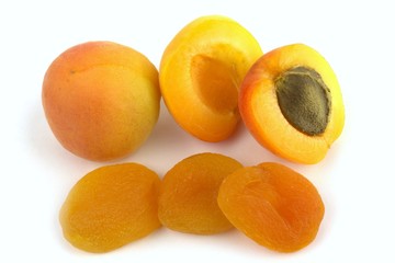 Fresh and sun dried apricots on white background.