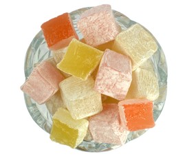 Turkish Delight in glass bowl on white background. Top view