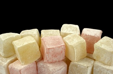 Turkish delight on black background.