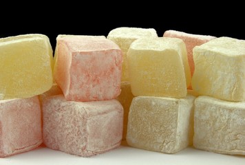Turkish delight on black background. Close up