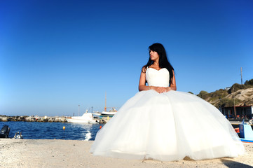 Bride on a Santorini port in Greece