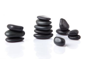 Black stones isolated on white background. Balancing Stones