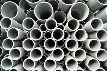 Gray plastic pipes stacked