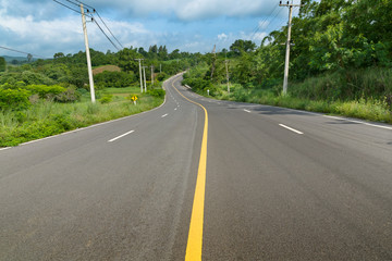Fototapeta na wymiar Yellow curve line on the road