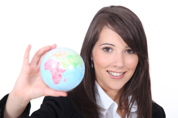 Young smart woman holding the world in her hand