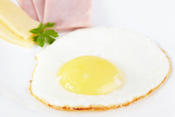 Fried eggs with cheese and ham