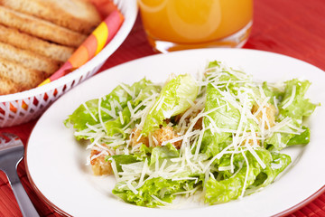 The Caesar salad prepared on the classical recipe