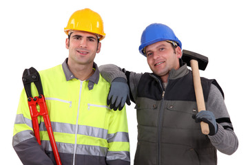 Two manual workers stood together