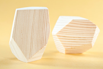 Wooden blocks Tumi-ishi on yellow background