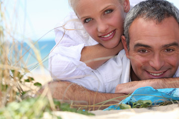Couple, laid down at the beach